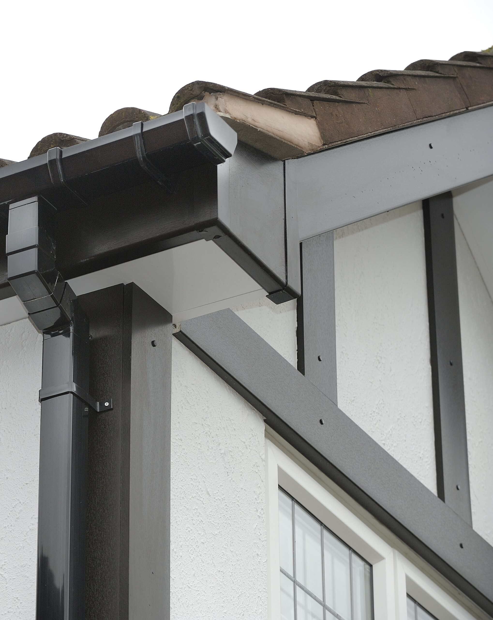 Traditional property featuring black Mock Tudor decorative boards